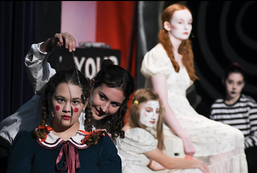 Left to right: Peaseblossom (Elizabeth Gray) is hypnotized by Puck (Georgia Hoffman), with onlookers Cobweb (Maggie Rhode), Mustardseed (Hayley OBrien) and ensemble (Katie Fisher)